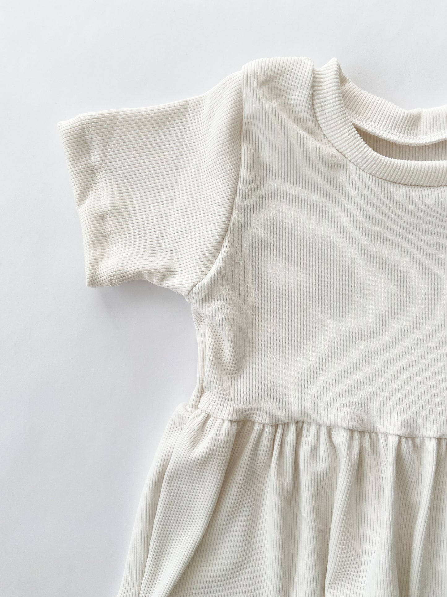 Ivory Rib Peplum